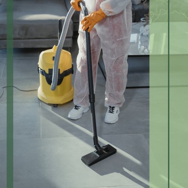 cleaner vacuuming the floor